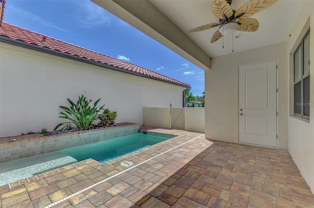 view of pool featuring ceiling fan and a patio