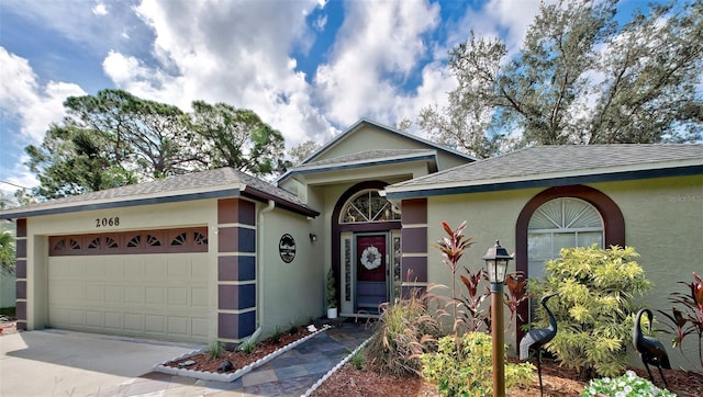 ranch-style home featuring a garage