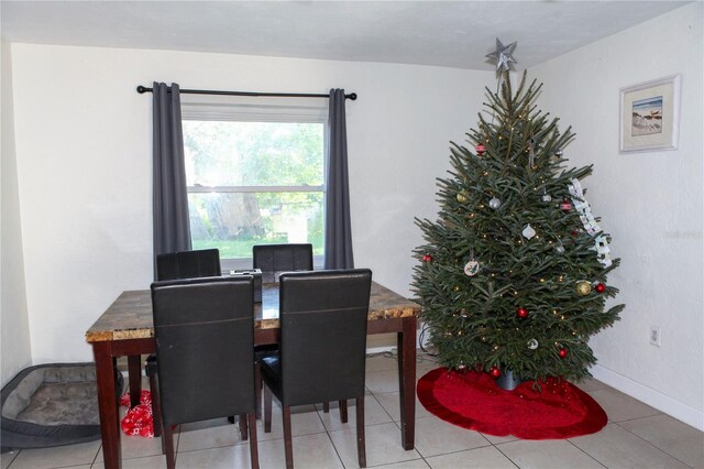 dining area with light tile patterned floors