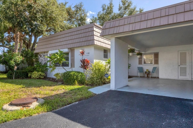 view of home's exterior with a yard