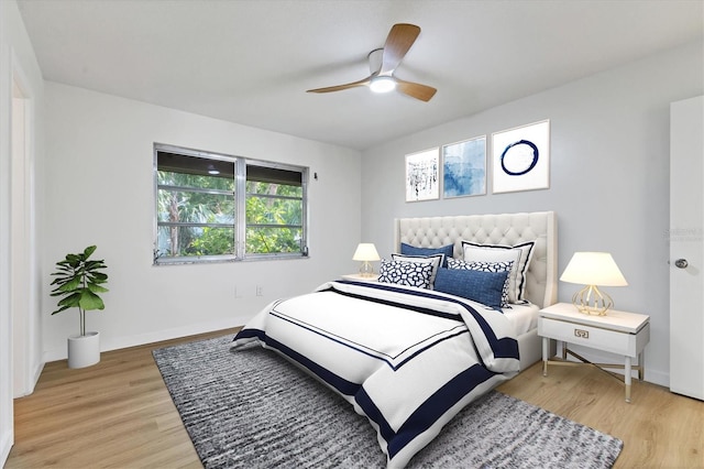 bedroom featuring light hardwood / wood-style flooring and ceiling fan