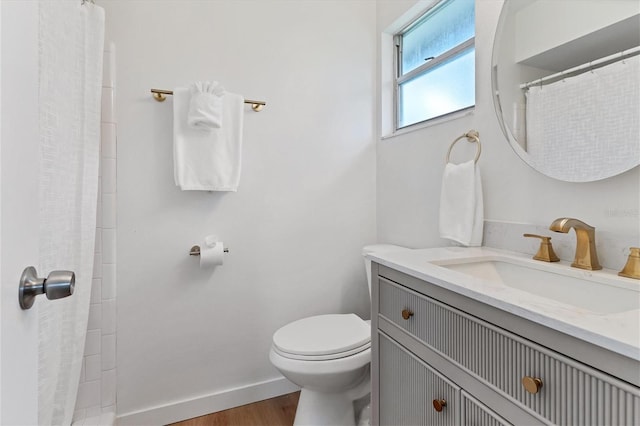 bathroom with vanity, toilet, a shower with shower curtain, and hardwood / wood-style flooring