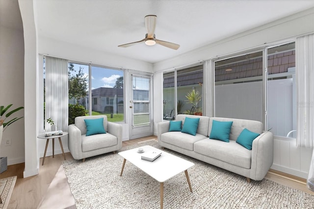 sunroom / solarium featuring ceiling fan