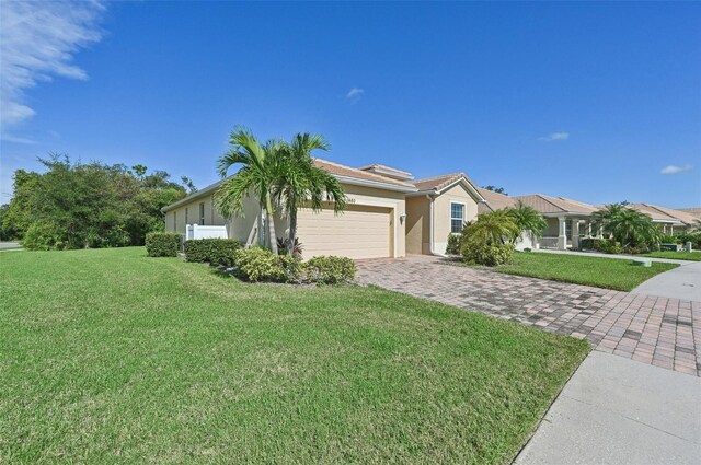 view of front of home with a garage and a front yard