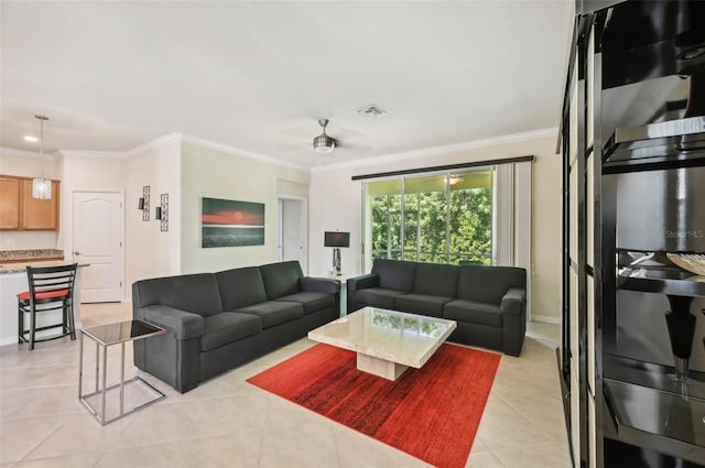 living room with light tile patterned floors, ceiling fan, baseboards, and crown molding