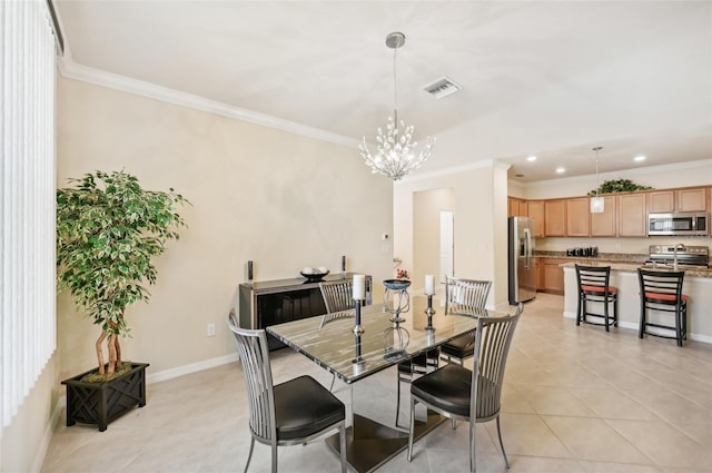 dining area featuring light tile patterned floors, a notable chandelier, visible vents, baseboards, and crown molding