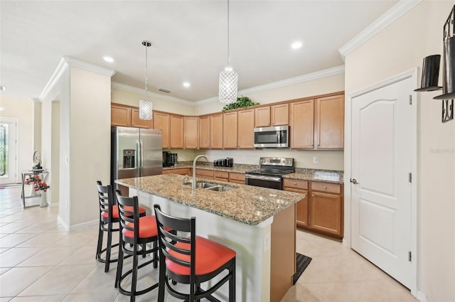 kitchen featuring appliances with stainless steel finishes, light tile patterned flooring, a sink, and crown molding