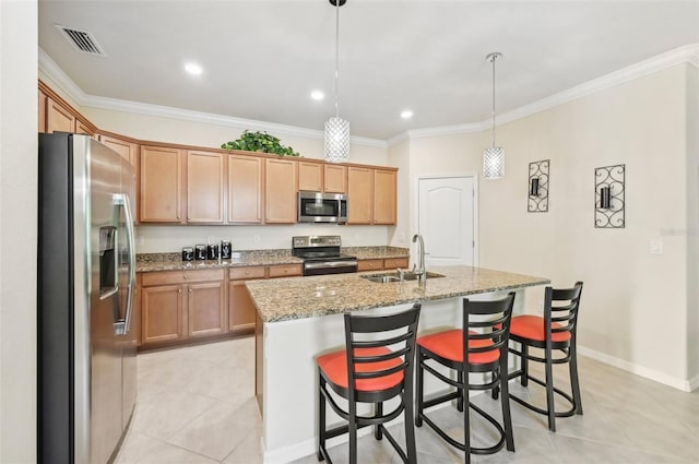 kitchen featuring visible vents, crown molding, appliances with stainless steel finishes, and a sink