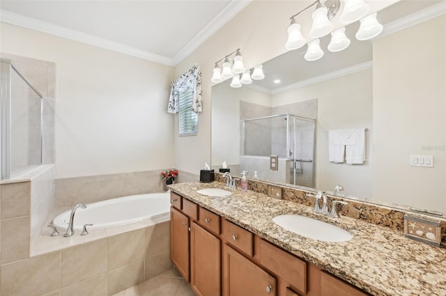 full bath with a stall shower, ornamental molding, a garden tub, and a sink