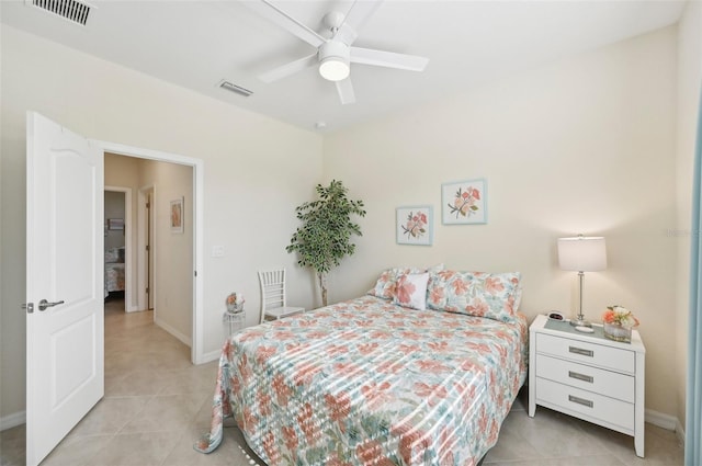 bedroom with light tile patterned floors, visible vents, and baseboards