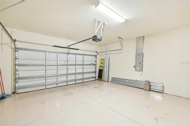 garage with electric panel and a garage door opener