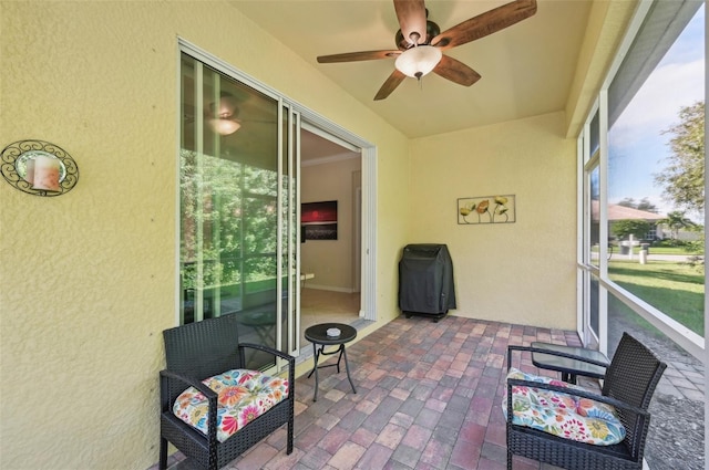 sunroom / solarium with ceiling fan