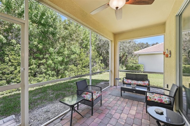 sunroom / solarium with ceiling fan