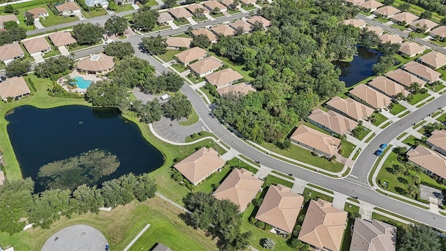 birds eye view of property featuring a water view and a residential view