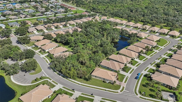 birds eye view of property featuring a water view and a residential view