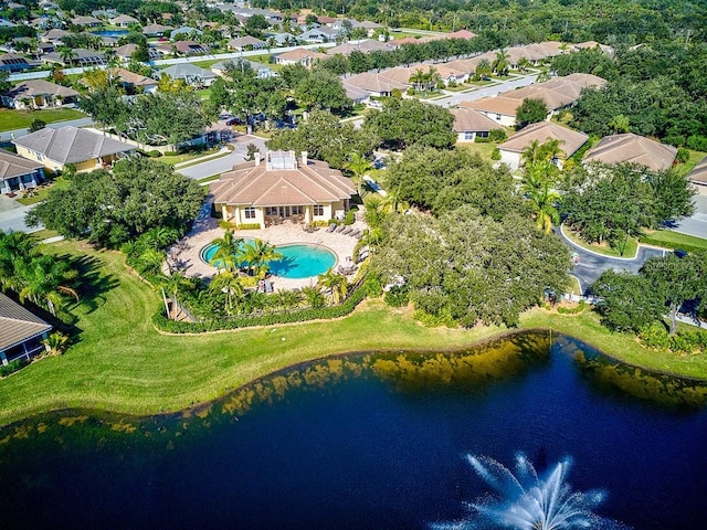 drone / aerial view with a residential view and a water view