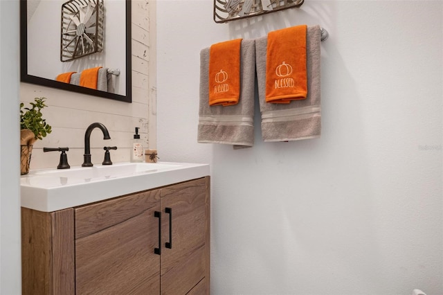 bathroom featuring decorative backsplash and vanity