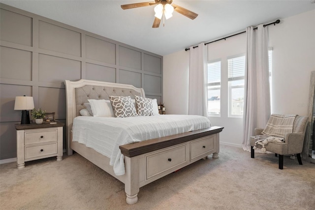 bedroom with ceiling fan and light colored carpet