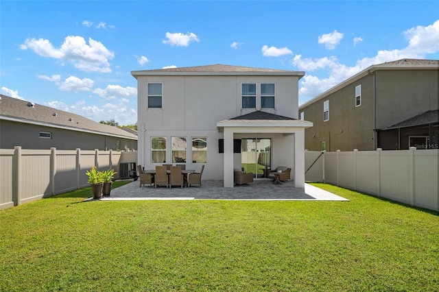 back of house with a yard, a patio, and an outdoor hangout area