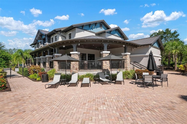 rear view of property featuring a patio