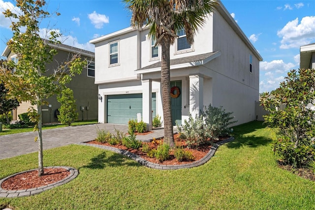 view of front of property with a front yard and a garage