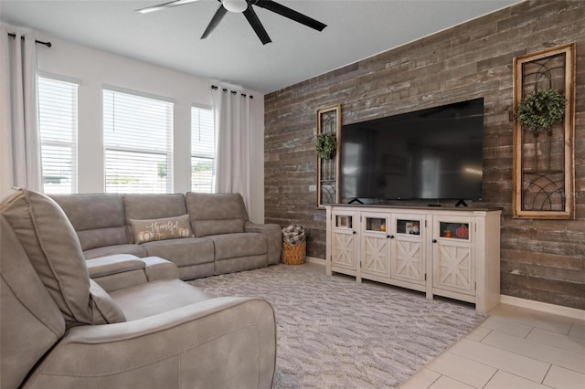 living room featuring ceiling fan and light tile patterned flooring