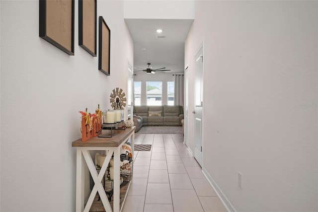 hallway with light tile patterned floors