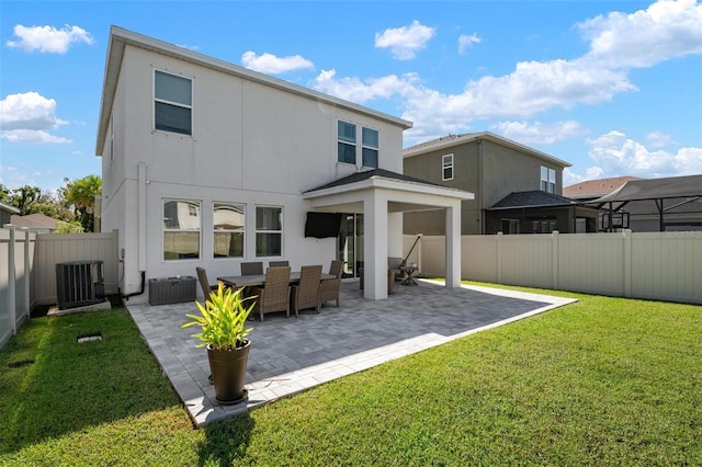 rear view of house with central AC, a yard, and a patio