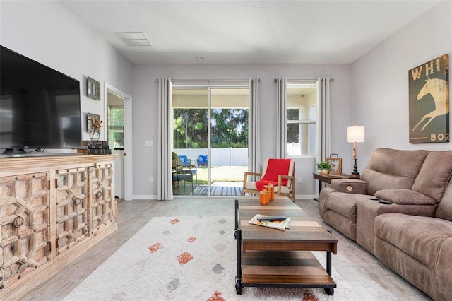 living room with light hardwood / wood-style floors