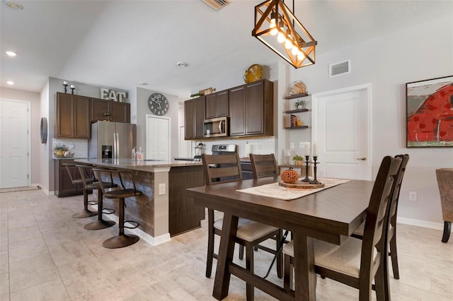 dining room featuring light tile patterned floors