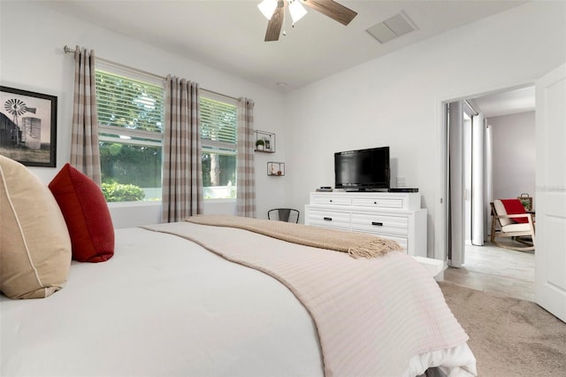 bedroom featuring ceiling fan and light colored carpet