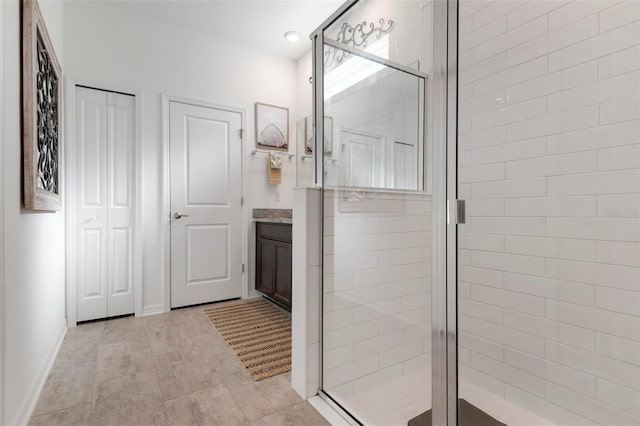 bathroom featuring vanity and walk in shower