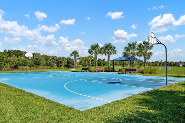 view of sport court featuring a lawn and a gazebo