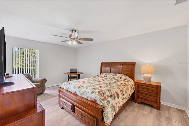 bedroom with ceiling fan and light hardwood / wood-style floors