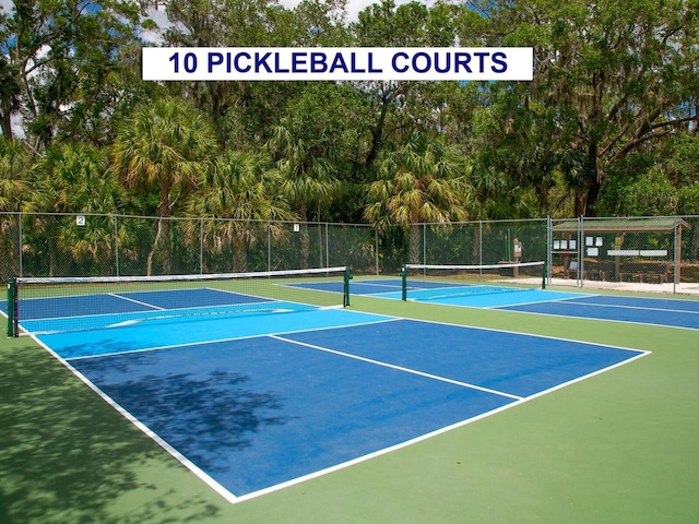 view of sport court with basketball hoop