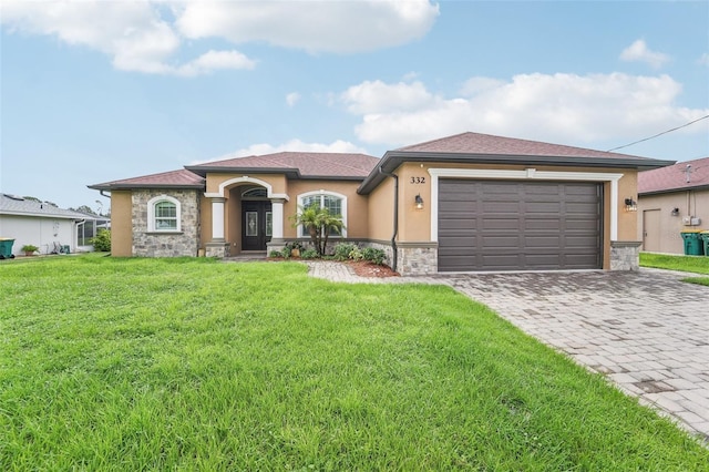 view of front of home with a garage and a front yard