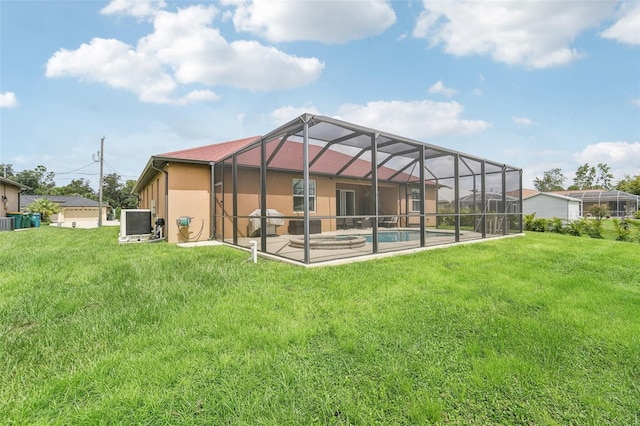 back of property featuring a patio area, cooling unit, a lanai, and a lawn