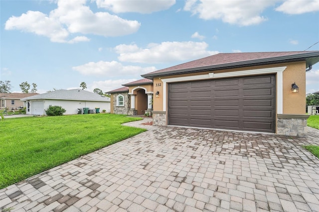 view of front of home with a garage and a front lawn