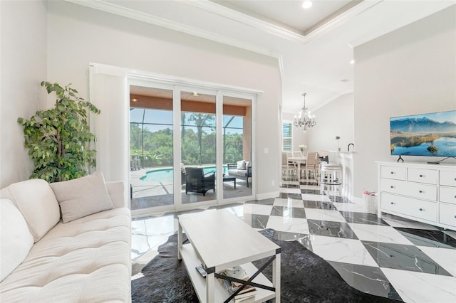 living room with crown molding and a notable chandelier