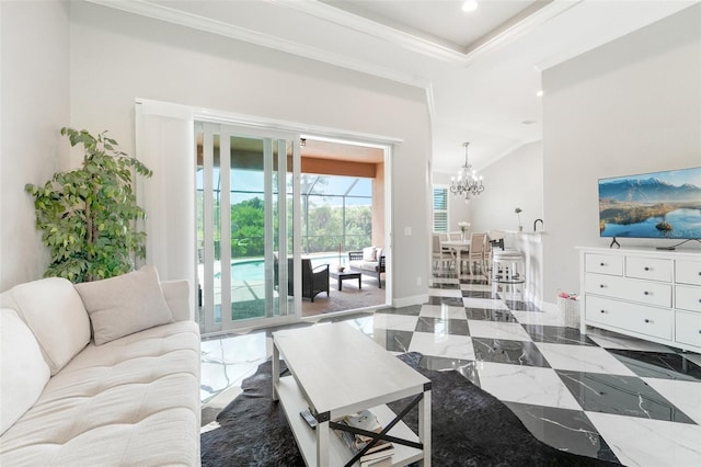 living room with an inviting chandelier and ornamental molding