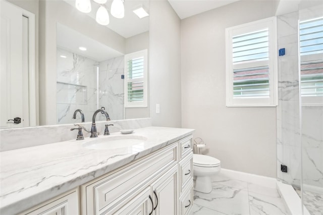 bathroom featuring vanity, toilet, and a shower with shower door