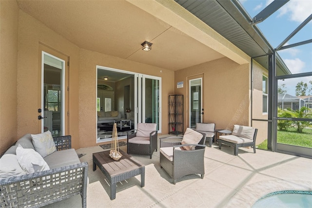 view of patio / terrace with glass enclosure and an outdoor living space