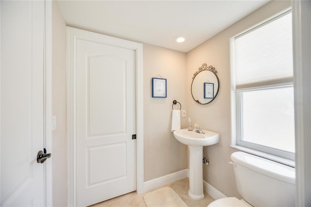 bathroom featuring tile patterned flooring and toilet