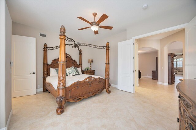 tiled bedroom with ceiling fan