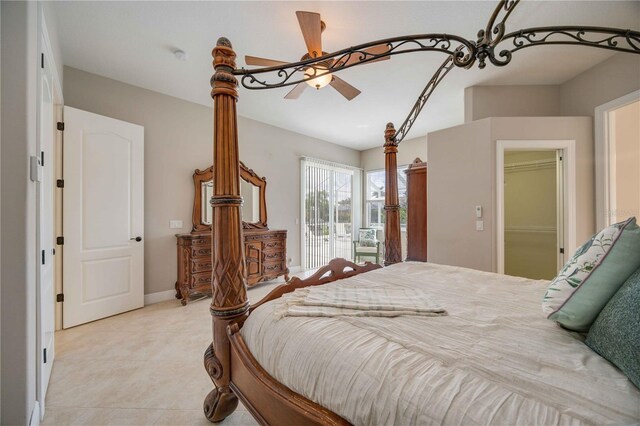 bedroom featuring a closet, ceiling fan, and a spacious closet