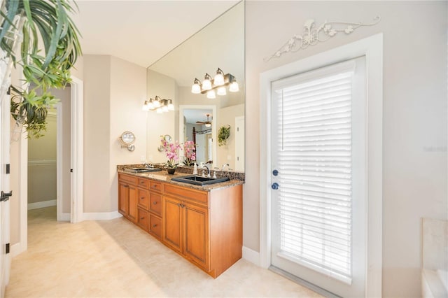 bathroom with plenty of natural light and vanity