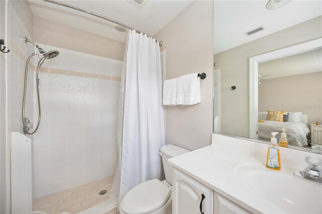 bathroom with vanity, toilet, and walk in shower