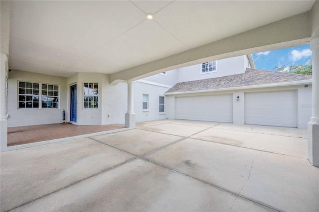 view of patio / terrace featuring a garage