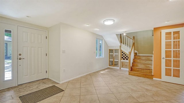 tiled foyer with a wealth of natural light