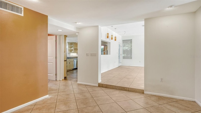 spare room featuring light tile patterned flooring